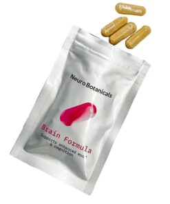 Close up of uniform clear vegetable capsules filled with a finely ground Brain Formula blend botanical powder